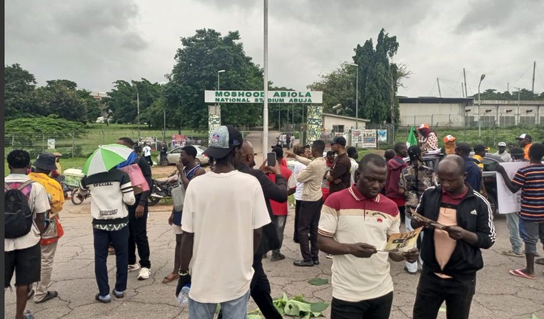 Security operatives disperse protesters with teargas at Abuja stadium